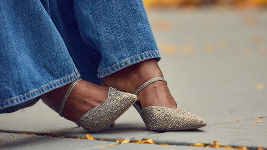 Fashion blogger Farotelle wearing blue jeans with silver pointed toe pumps, holiday party shoes, strappy mules, Minneapolis blogger, black fashion blogger