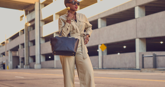 Farotelle wearing neutral Banana Republic utility jumpsuit with large black leather tote and oversized gold earrings as Spring Summer Elevated Casual Workwear, Weekend Outfit, Classic Style.