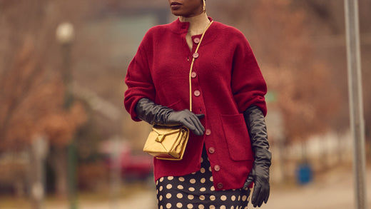 Fashion blogger Farotelle wearing a burgundy oversized cardigan with a gold crossbody handbag and black opera leather gloves, Winter outfit ideas, how to style an oversized cardigan, how to style a slip skirt, Minneapolis blogger