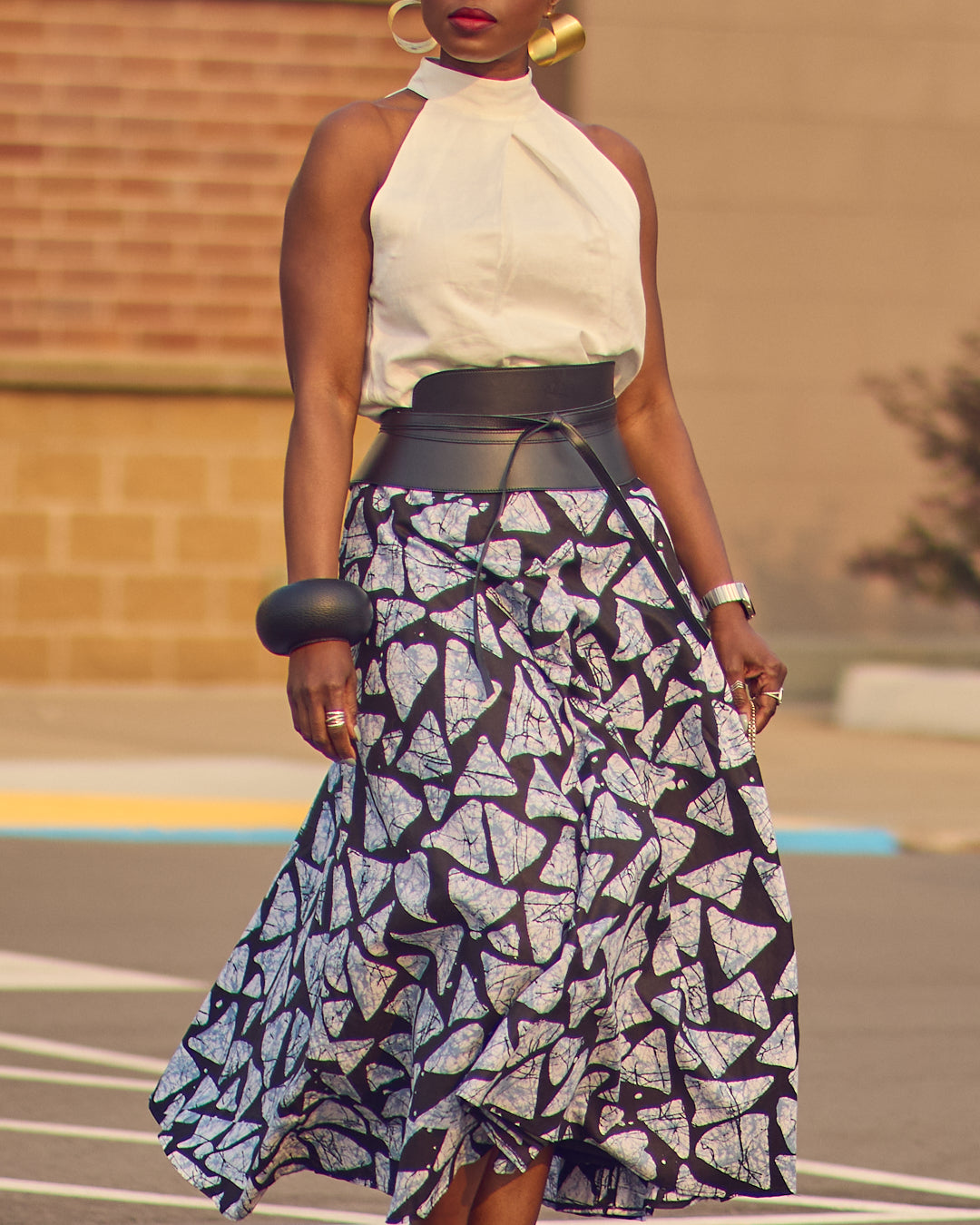 Spring and Summer skirt outfits, adire batik print skirt, how to style a full printed skirt, linen halter top, black and white outfits, how to style a leather waist belt, classic fashion, feminine style, Farotelle fashion blog, top Minneapolis fashion influencer