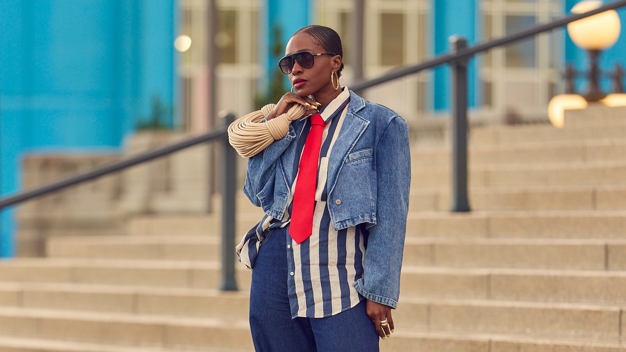 Red, white, and blue Summer outfit, indigo blue jeans with an oversized striped shirt, how to style a red tie, wide-leg jeans outfit, red leather pumps, Levi's jeans, H&M shirt, Bottega Venetta spaguetti bag, nautical Summer looks, Americana, Farotelle fashion blog, Minneapolis top fashion influencer, fashion over 40, slow fashion, classic style, Ann Taylor, Revolve jackets