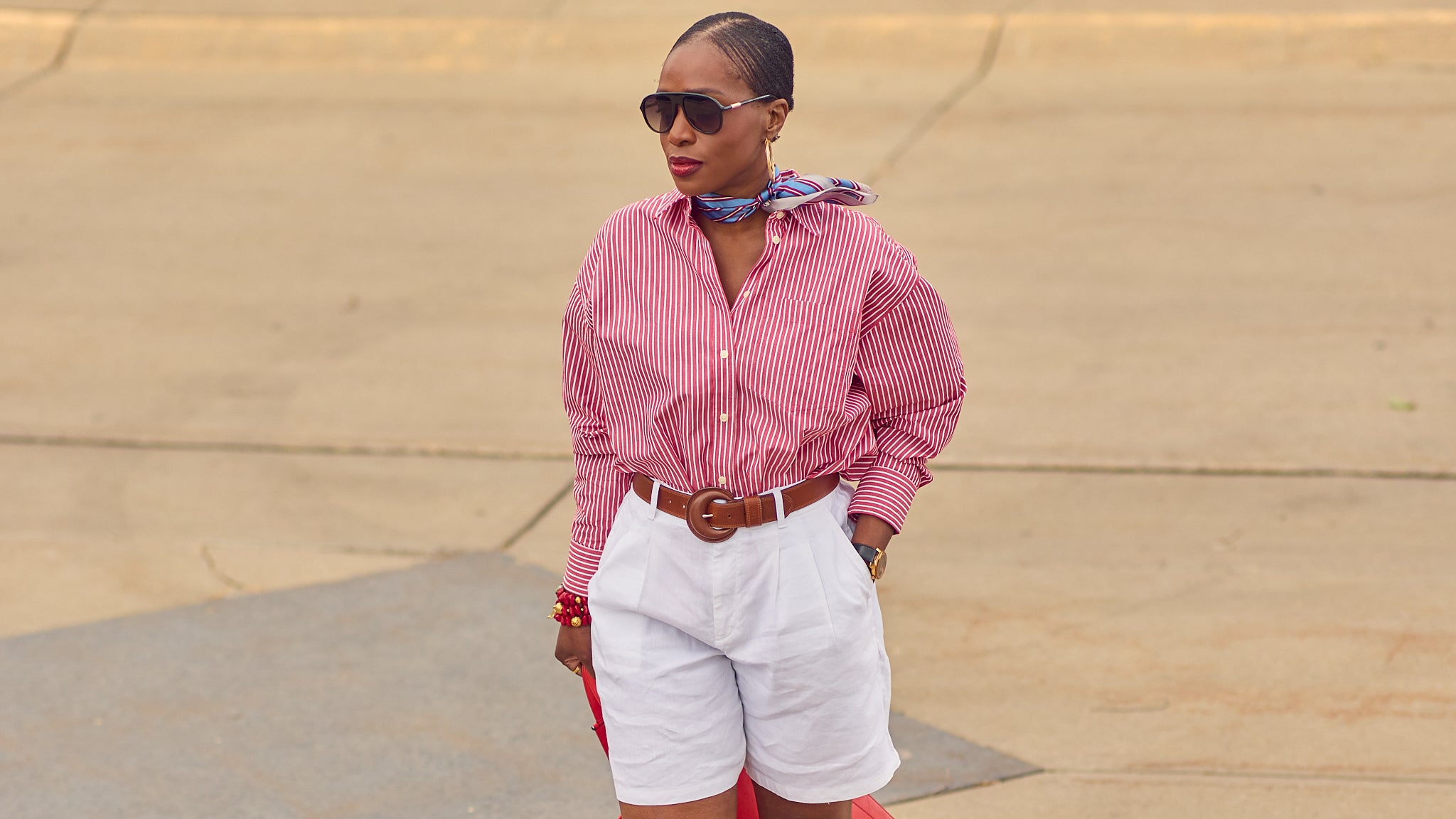 Red, white, and blue Summer outfit, how to style white shorts, Summer elevated shorts outfit inspo, oversized striped shirt and shorts outfit, J.Crew Etienne shirts, Americana, Farotelle fashion blog, silk scarf styling, Minneapolis top fashion influencer, fashion over 40, slow fashion, classic style, G.H.Bass loafers, Levi's belts, Tomoli Fitini Kora leather tote, color-blocked outfit, nautical fashion