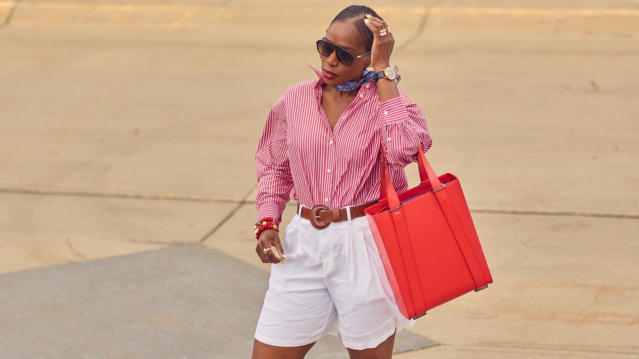 Red, white, and blue Summer outfit, how to style white shorts, Summer elevated shorts outfit inspo, oversized striped shirt and shorts outfit, J.Crew Etienne shirts, Americana, Farotelle fashion blog, silk scarf styling, Minneapolis top fashion influencer, fashion over 40, slow fashion, classic style, G.H.Bass loafers, Levi's belts, Tomoli Fitini Kora leather tote, color-blocked outfit, nautical fashion