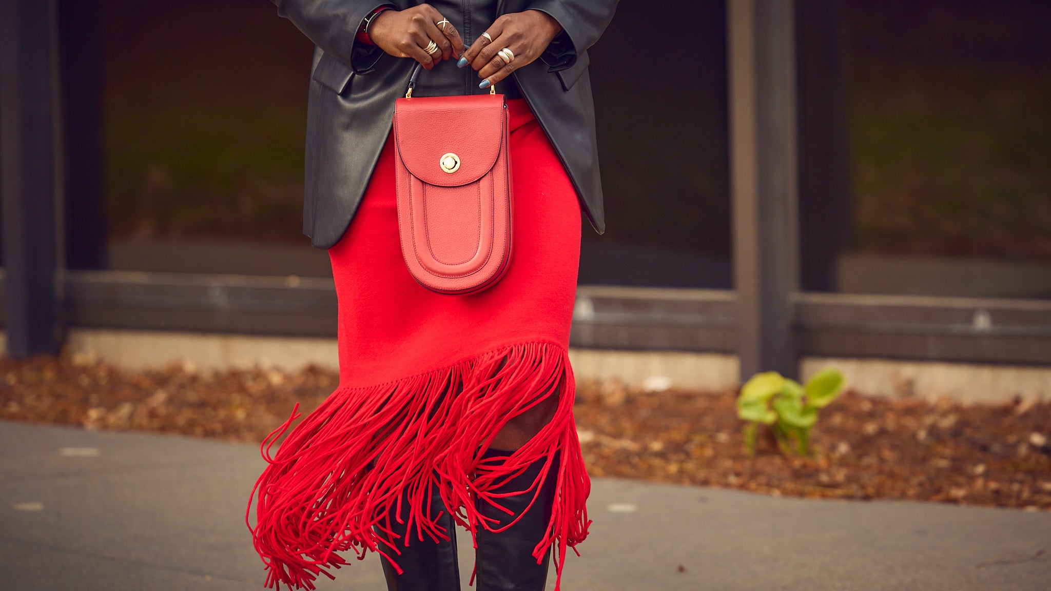 Fall fashion inspo, how to style a red skirt, fringe skirt, tall leather boots, Farotelle fashion blog, Minneapolis fashion content creator, fashion over 40, classy and elegant looks, Tomoli Fitini red leather bag